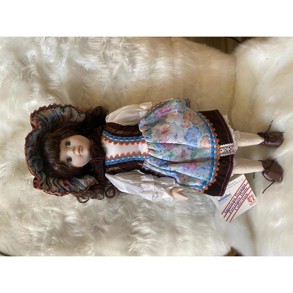 Vintage Porcelain Doll with Floral Dress and Bonnet